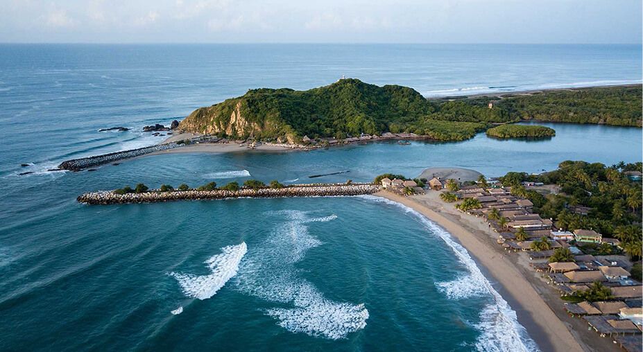 Aerial view of the Lagunas de Chacahua inlet, where the lagoon meets the Pacific.